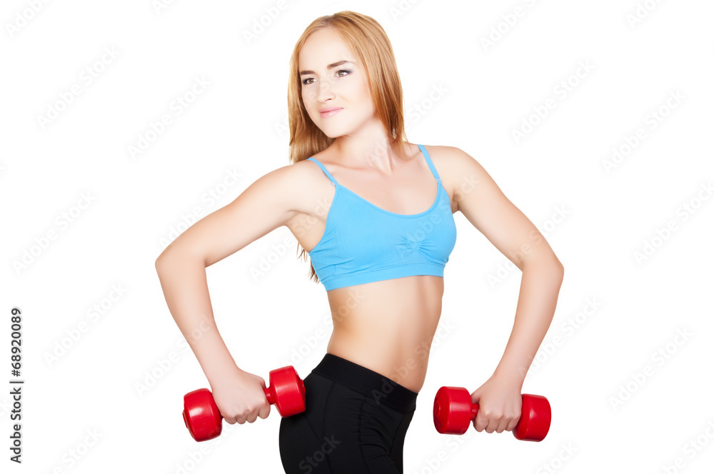 Young fit woman lifting dumbbells on white background Young fit woman lifting dumbbells on white background