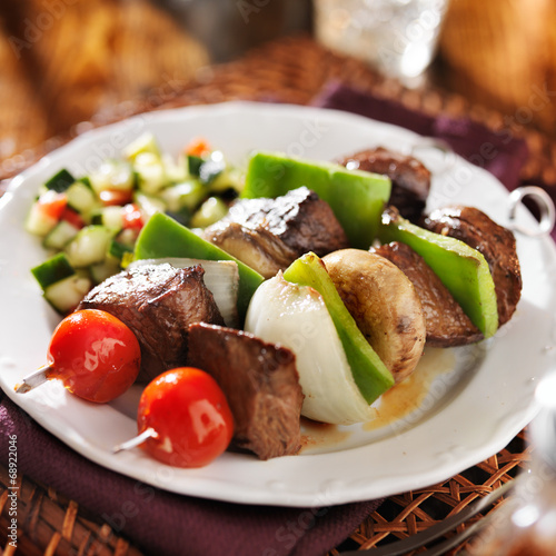 steak and vegetable shishkabobs with cucumber salad photo