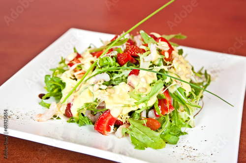 Mix salad with prawns and strawberry