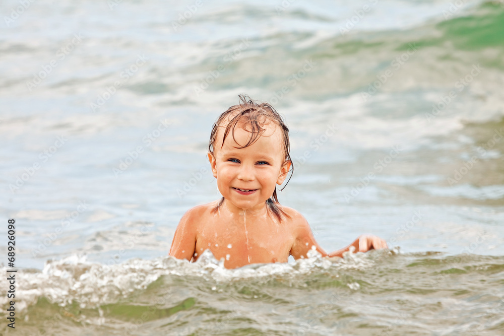 Funny toddler in the sea