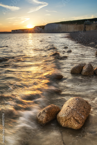 Landscape image of sunset over Birling Gap in England photo