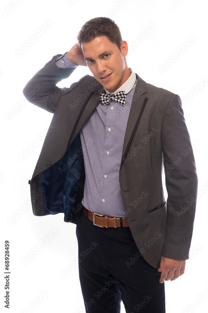 Handsome trendy young man scratching his head Handsome trendy young man scratching his head