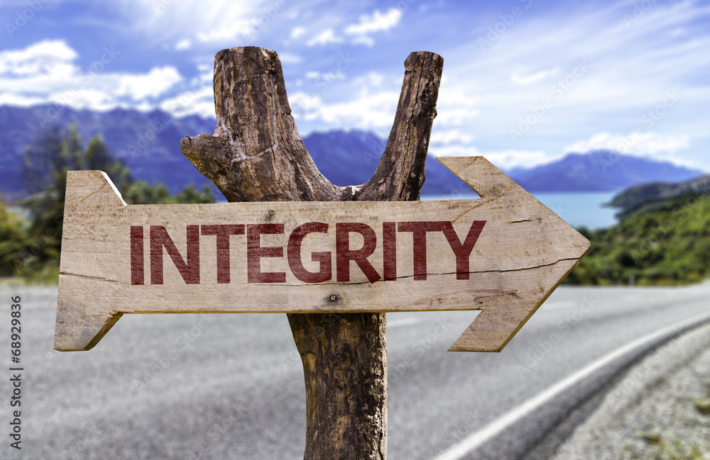 Integrity wooden sign with a street background