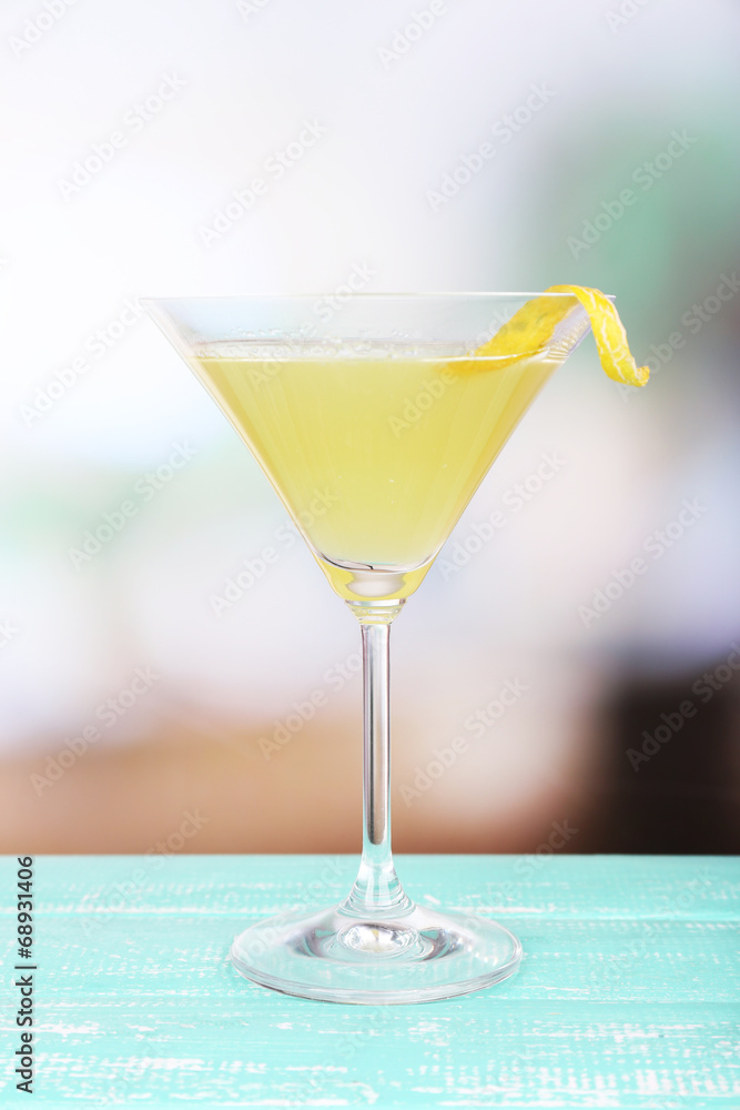 Melon smoothie in glass on table on bright background Melon smoothie in glass on table on bright background