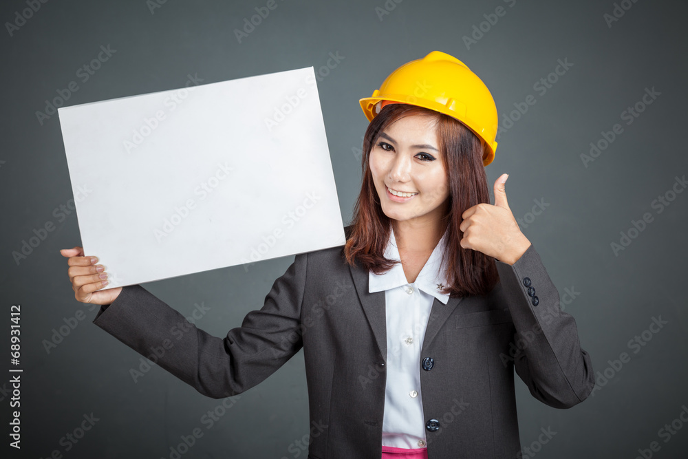 Asian engineer girl thumbs up with a blank sign Asian engineer girl thumbs up with a blank sign