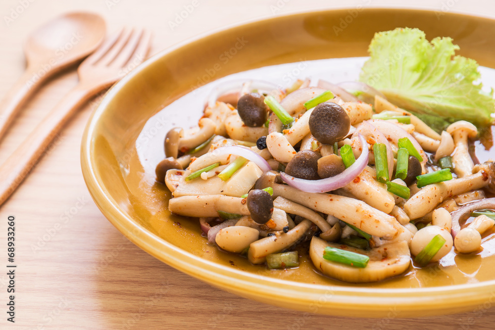 Spicy mushroom salad on plate, Thai food style Spicy mushroom salad on plate, Thai food style