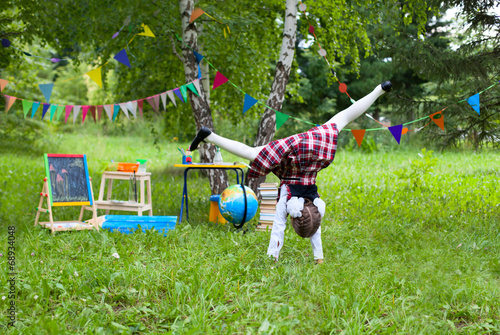 Schoolgirl child kid jumping tumbling turning handsprings photo