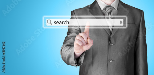 Businessman pushing virtual search bar