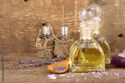 Fototapeta Naklejka Na Ścianę i Meble -  Spa still life with lavender oil and flowers on wooden table