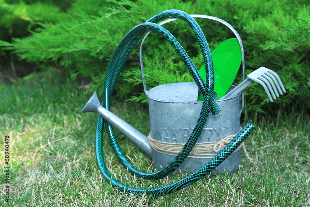 Garden tools on green grass background Garden tools on green grass background