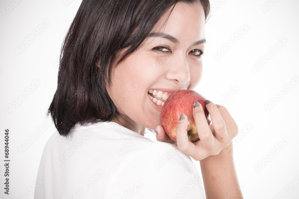 Smiling woman with apple isolated on white Smiling woman with apple isolated on white