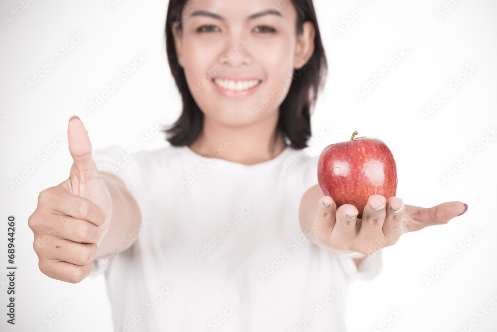 Smiling woman with apple isolated on white Smiling woman with apple isolated on white
