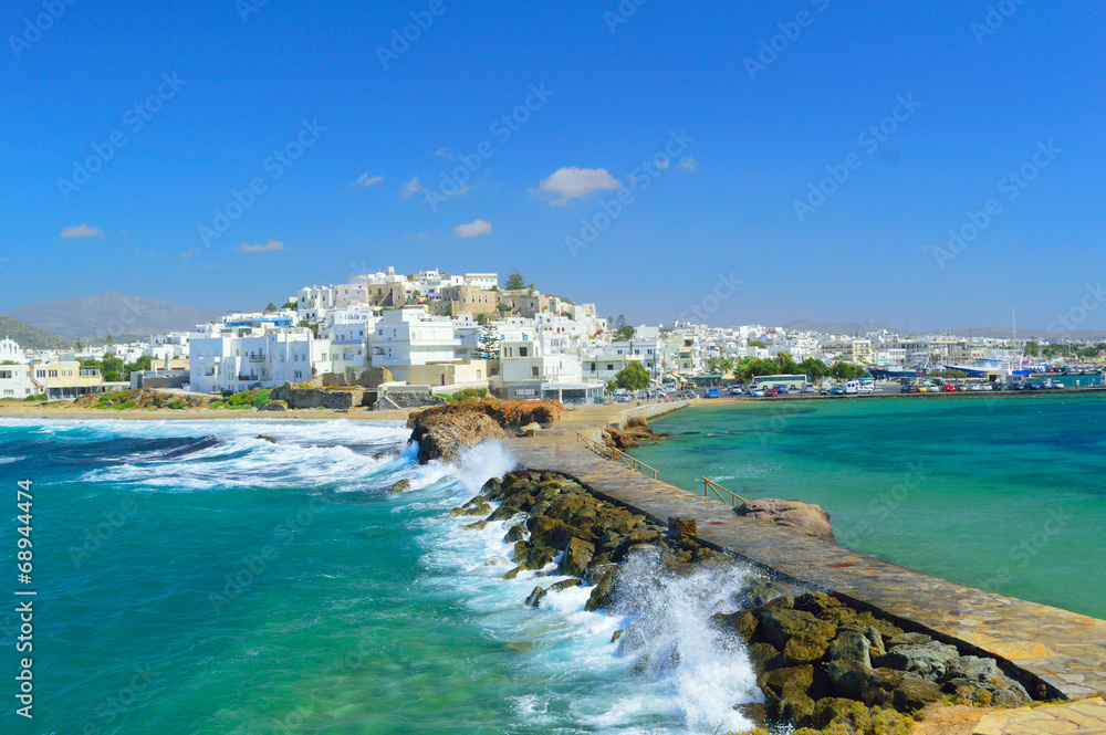 Waves breaking on Naxos town pier, Greece - obrazy, fototapety, plakaty 