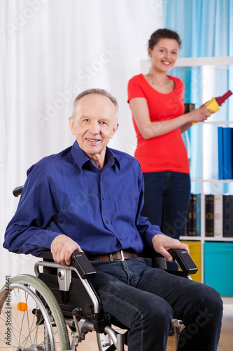 Disabled man and helpful granddaughter