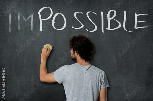 Young Man Erasing Impossible