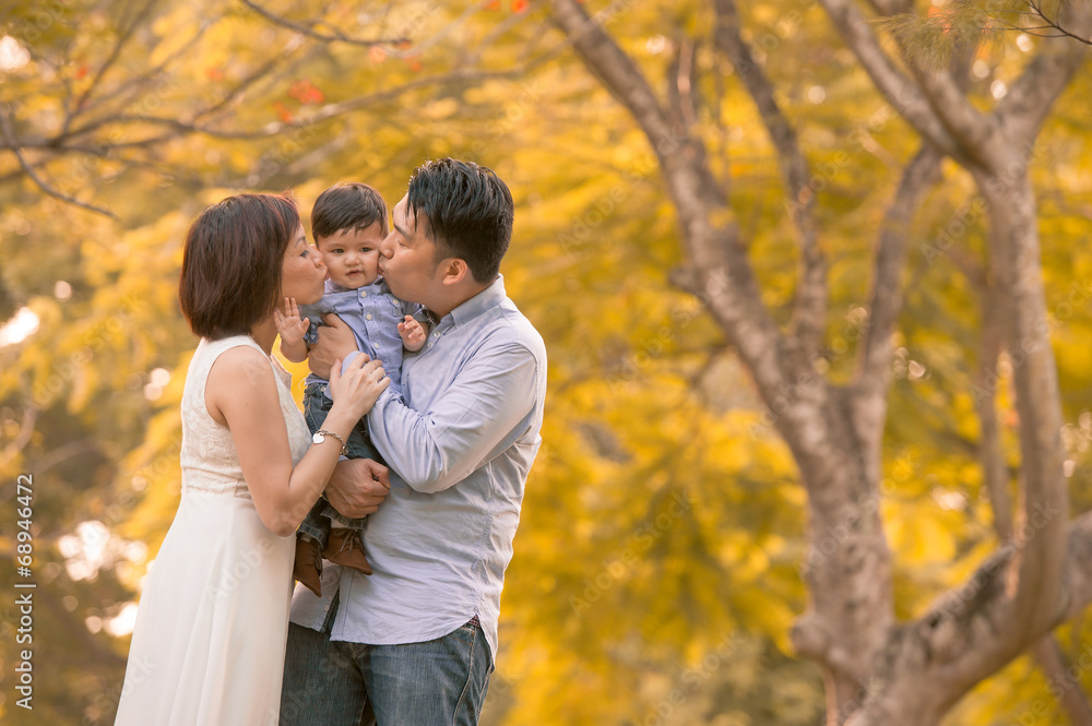 Asian young family having fun outdoors Asian young family having fun outdoors