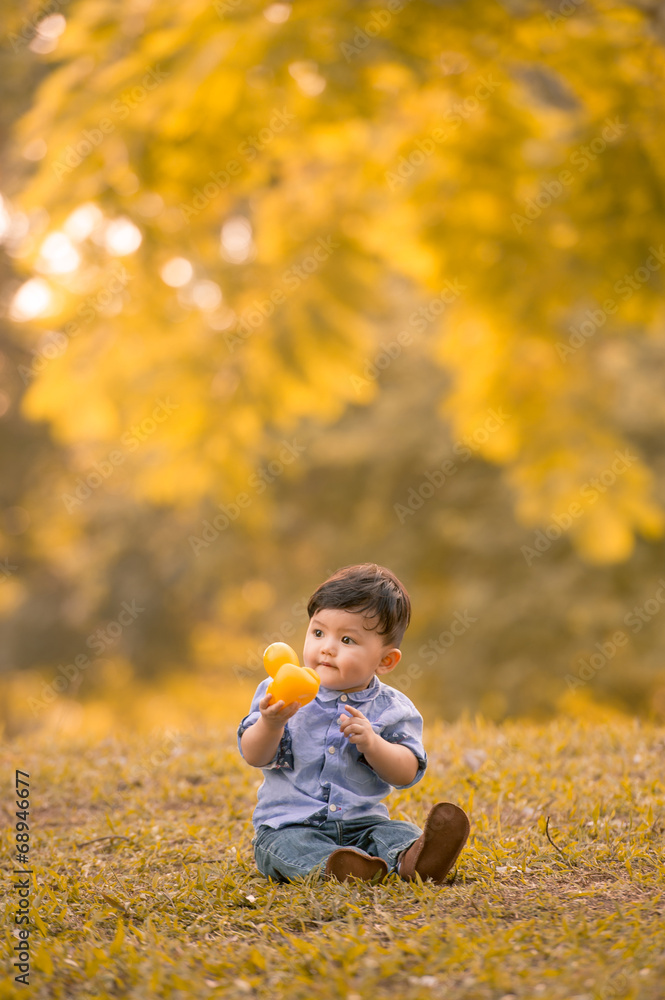 Asian 10-month old boy having fun outdoors Asian 10-month old boy having fun outdoors