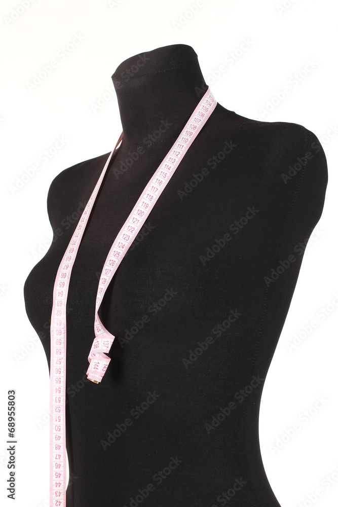 female mannequin with a tape measure on white background female mannequin with a tape measure on white background