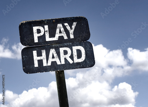 Play Hard sign with clouds and sky background photo