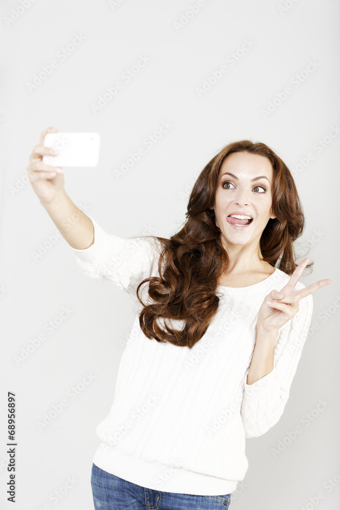 Woman taking a self portrait Woman taking a self portrait