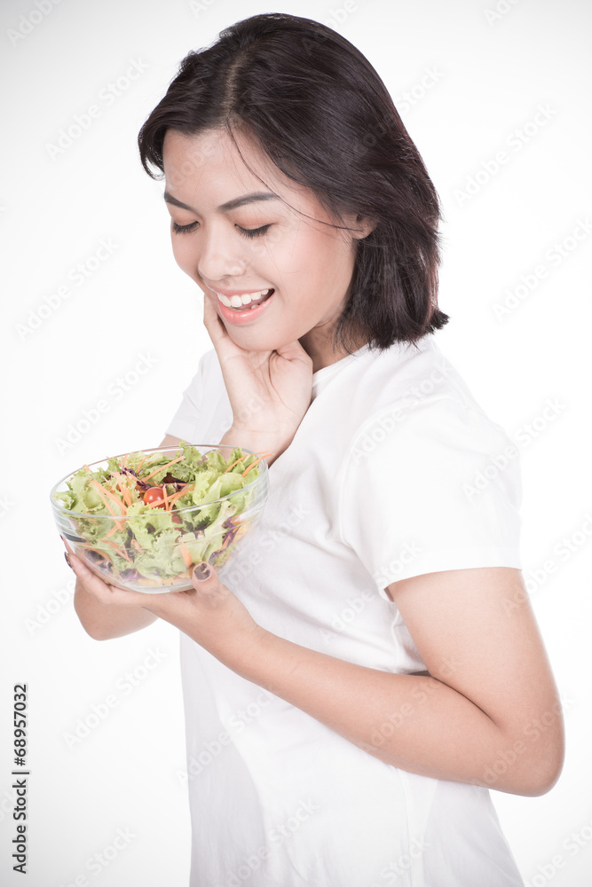 Pretty girl eating fresh vegetable salad Pretty girl eating fresh vegetable salad