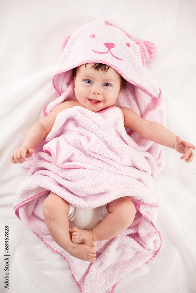 smiling baby looking at camera under a white blanket/towel smiling baby looking at camera under a white blanket/towel