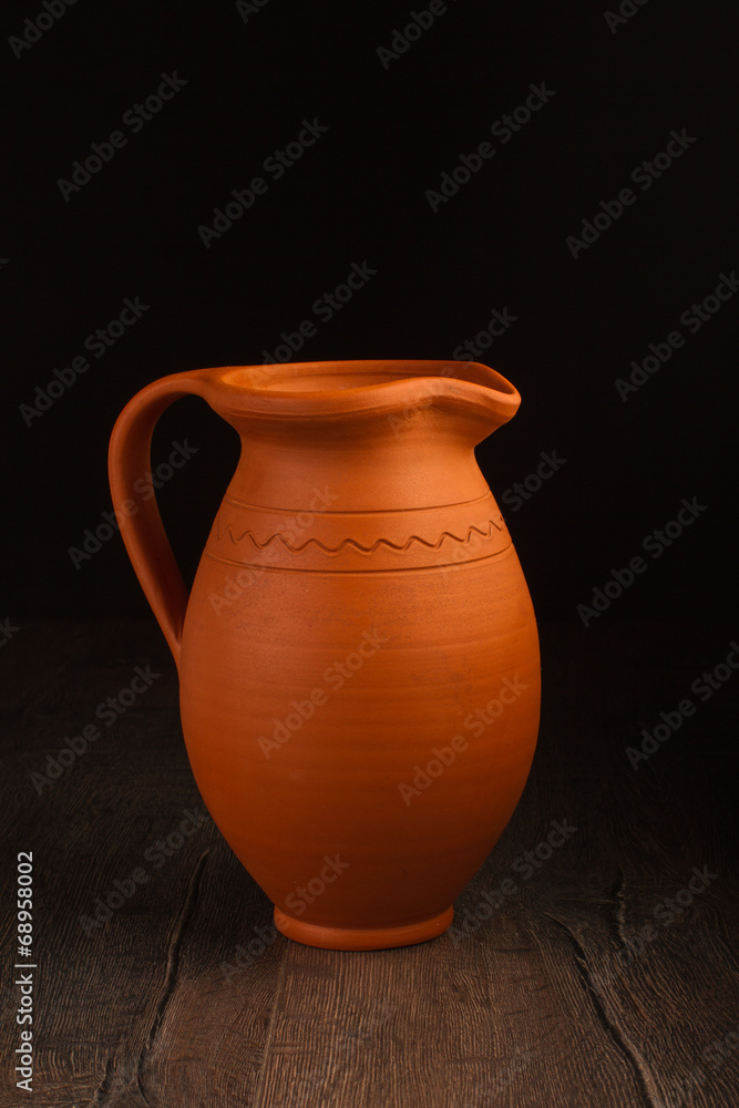 Vintage ceramic pot on wooden table