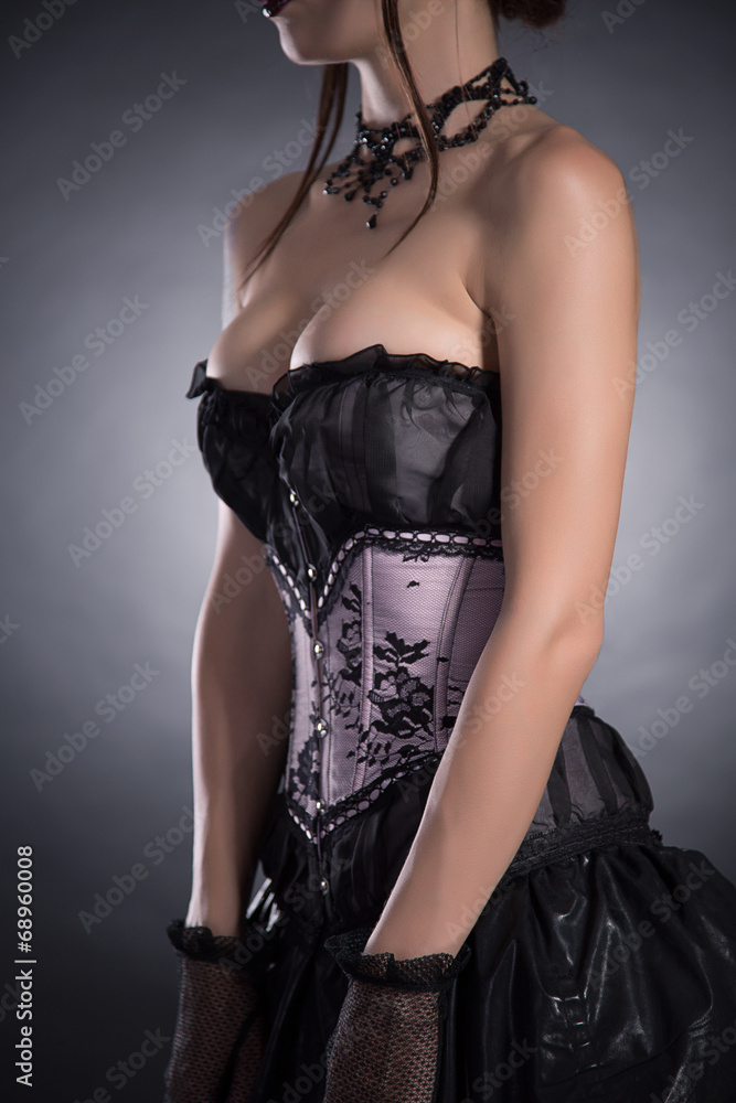 Close-up shot of a busty woman in elegant corset Stock Photo | Adobe Stock