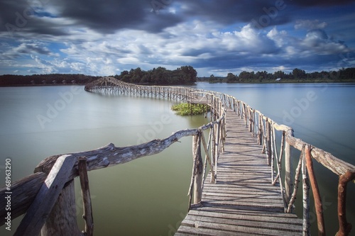 Wooden bridge crossover reservoir southern of Thailand