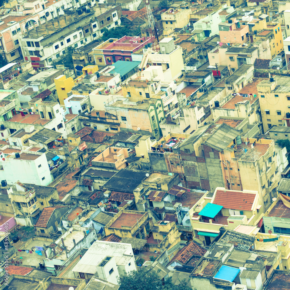 retro style  image of colorful homes in crowded Indian city Tri