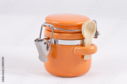 Ceramic orange salt shaker with a lid