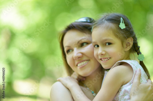 Mother with daughter in summer