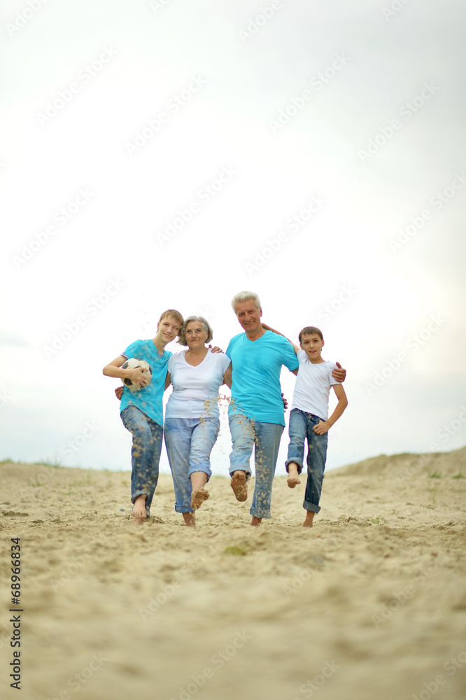 Grandparents with grandchildren on the beach Grandparents with grandchildren on the beach