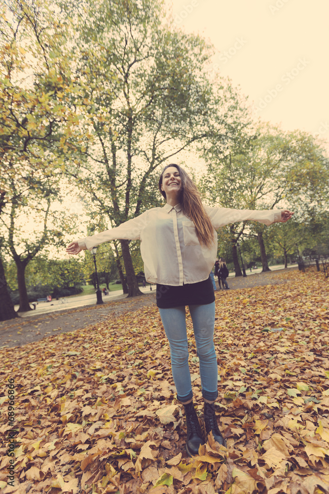 Joyful Woman at Park in Autumn Joyful Woman at Park in Autumn