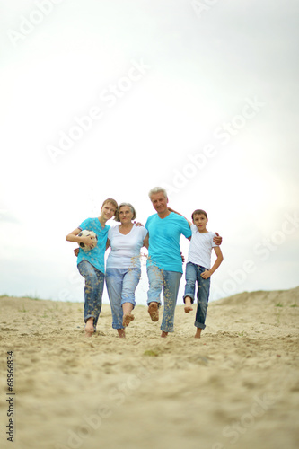 Grandparents with grandchildren on the beach