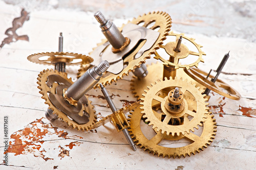 mechanical clock gears on the old wooden table