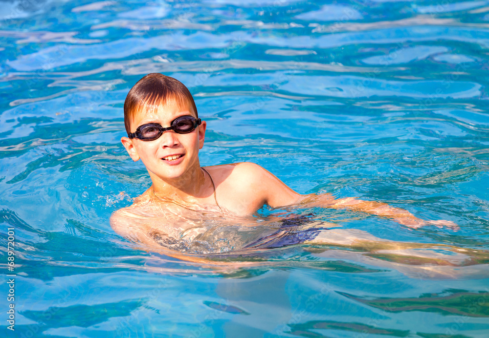 Ten year old boy in swimming pool
