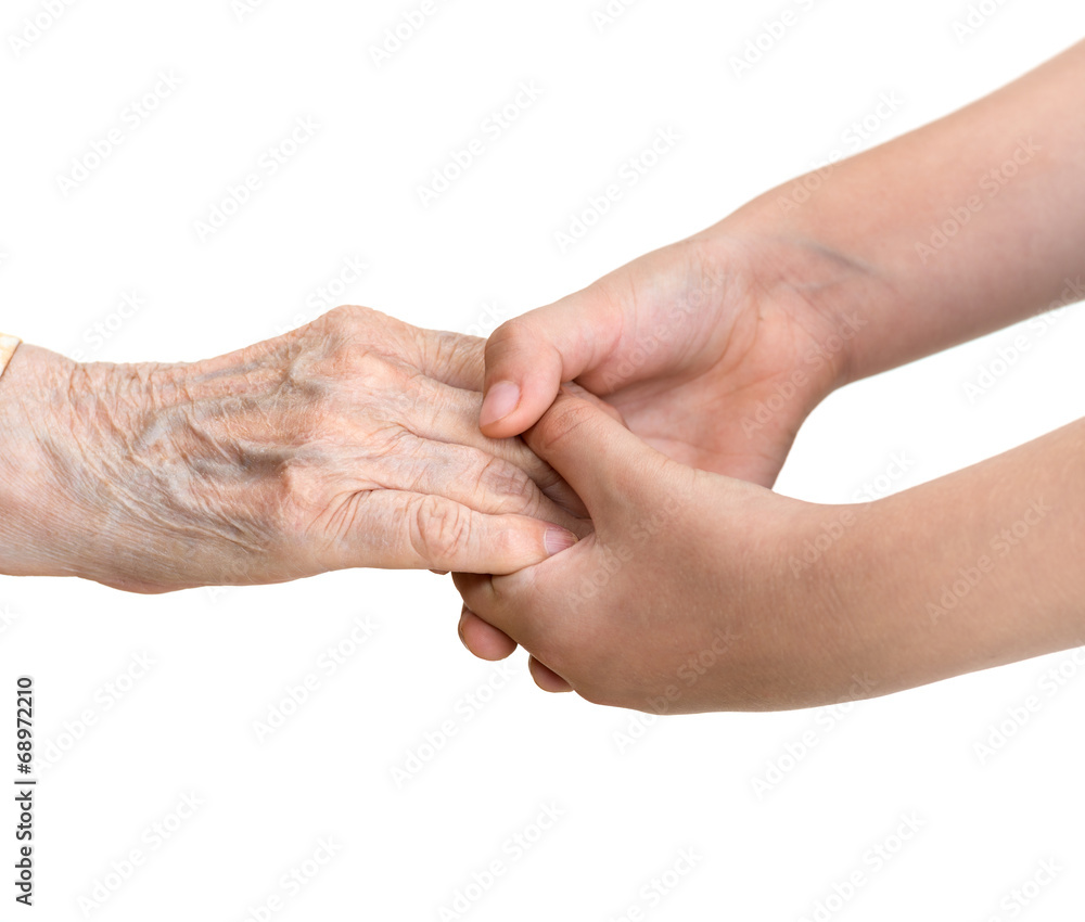 Senior woman and young girl holding hands Senior woman and young girl holding hands