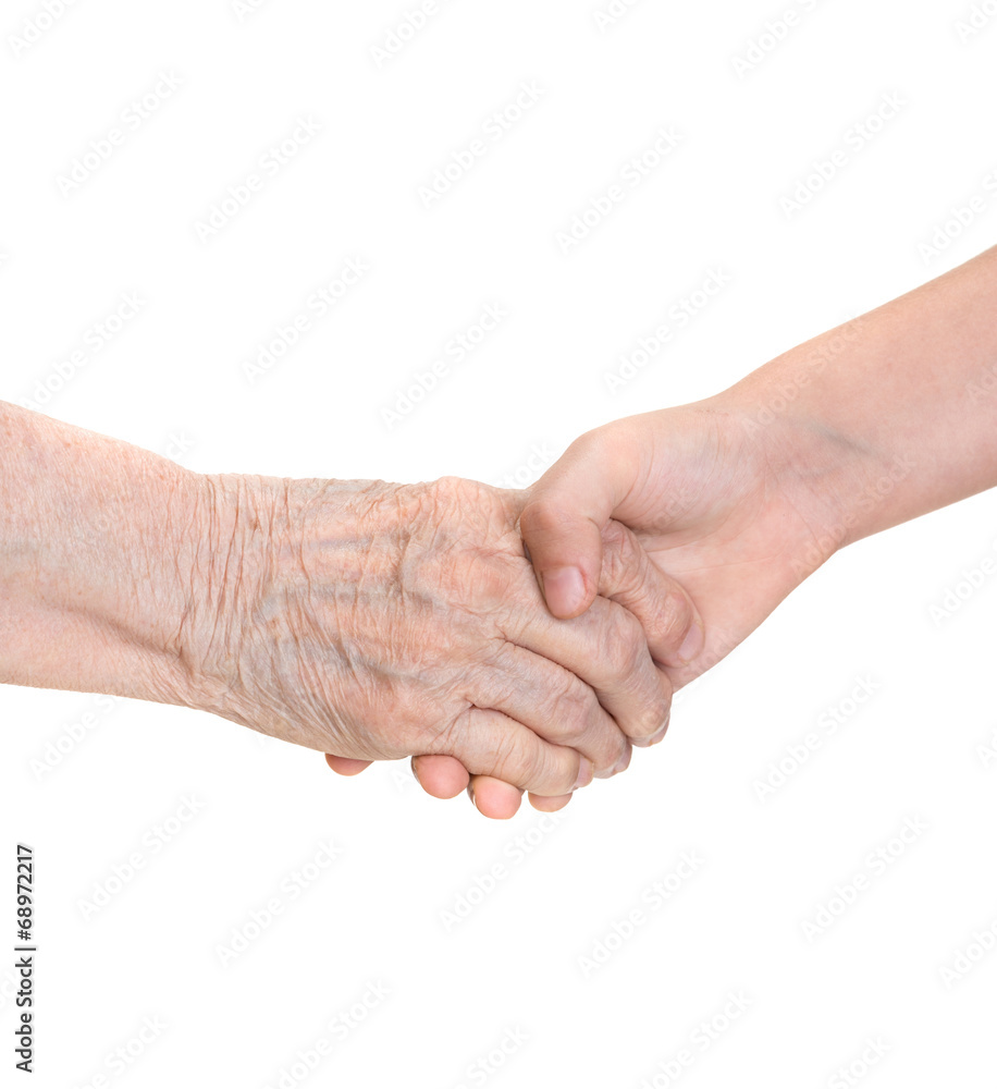 Senior woman and young girl  holding hands