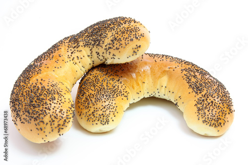 Rolls with poppy seeds on white background
