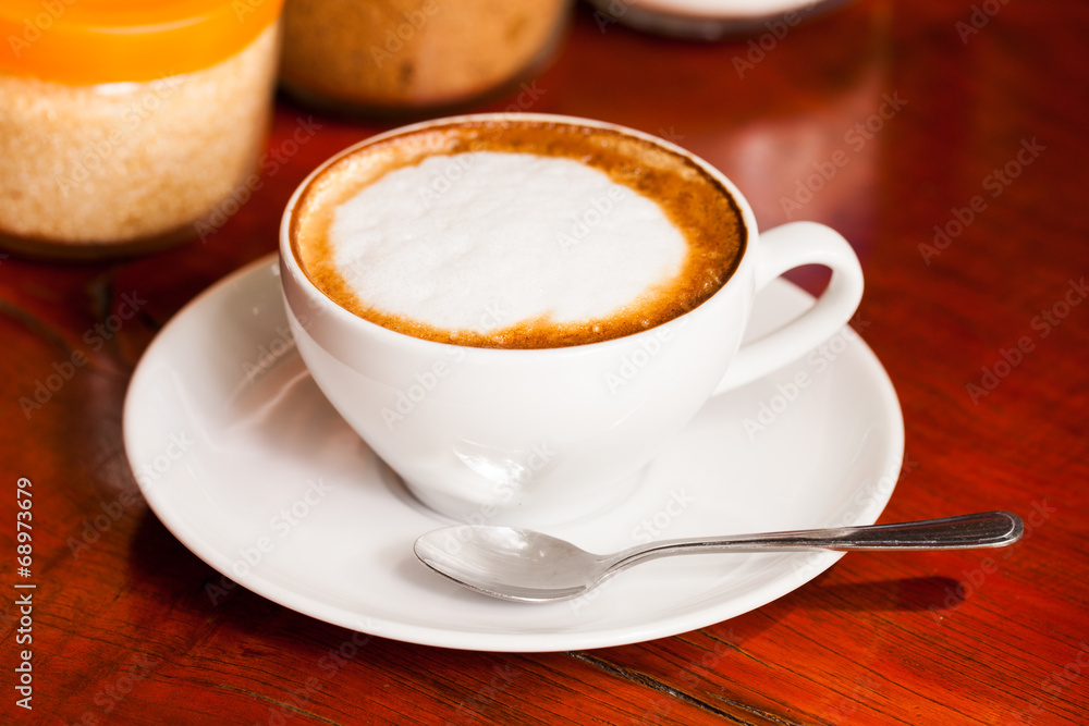 Cup of cappuccino or latte coffee on wood. Cup of cappuccino or latte coffee on wood.