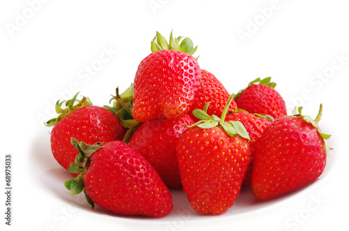 Three fresh strawberries isolated on white background.