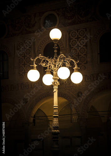Old street lamp with mosquitoes