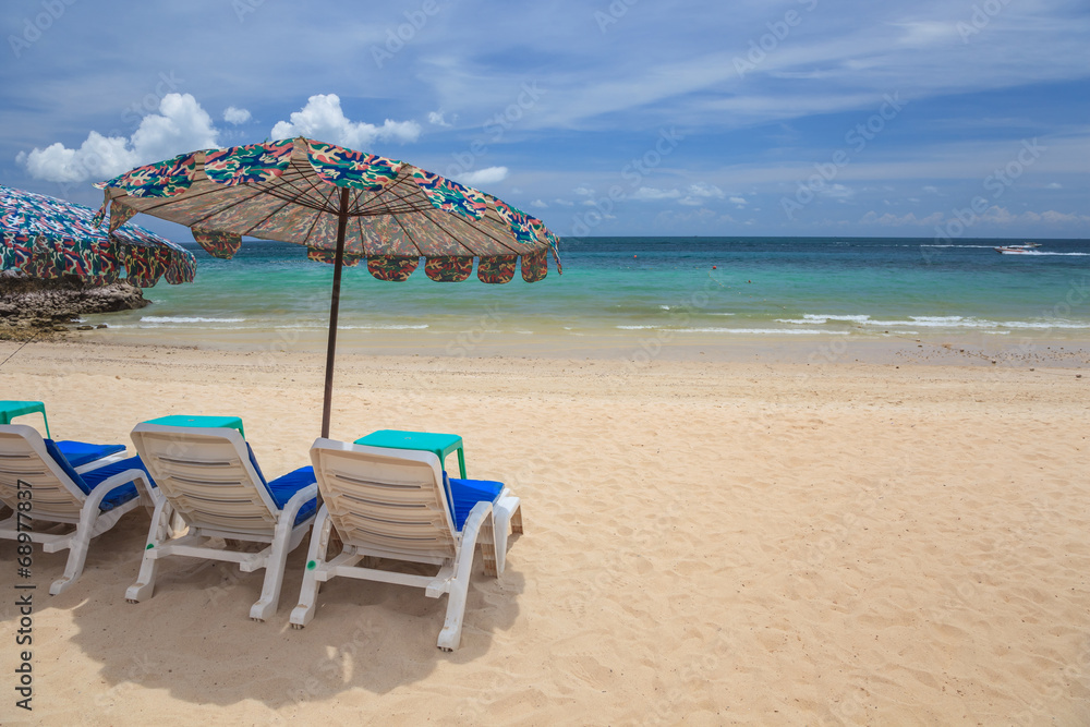 tropical beach and beach chair with umbrella