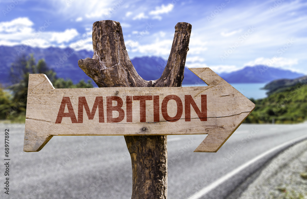 Ambition wooden sign with a street background