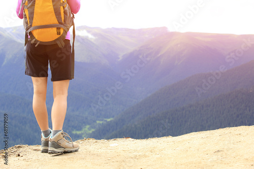 cheering young woman hiker open arms mountain peak 