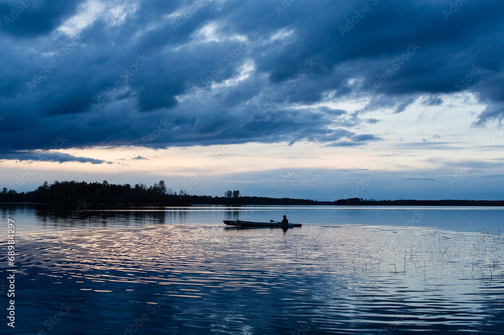 Obraz premium Sunset kayaking at lake