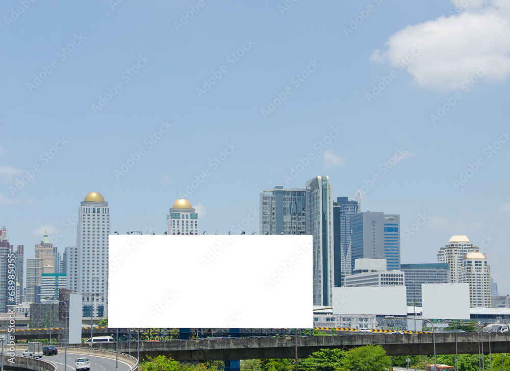 large blank billboard on road with city view background large blank billboard on road with city view background