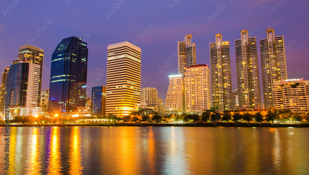city downtown at night with building reflection in the river Ban