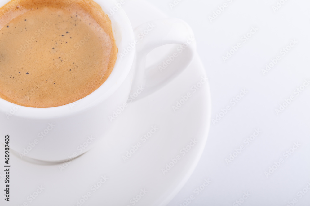 White cup of coffee on white background White cup of coffee on white background